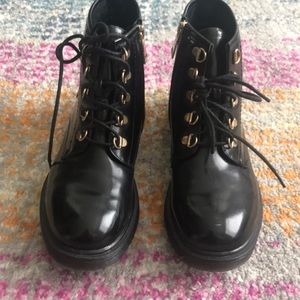 Women’s black patent leather combat boots